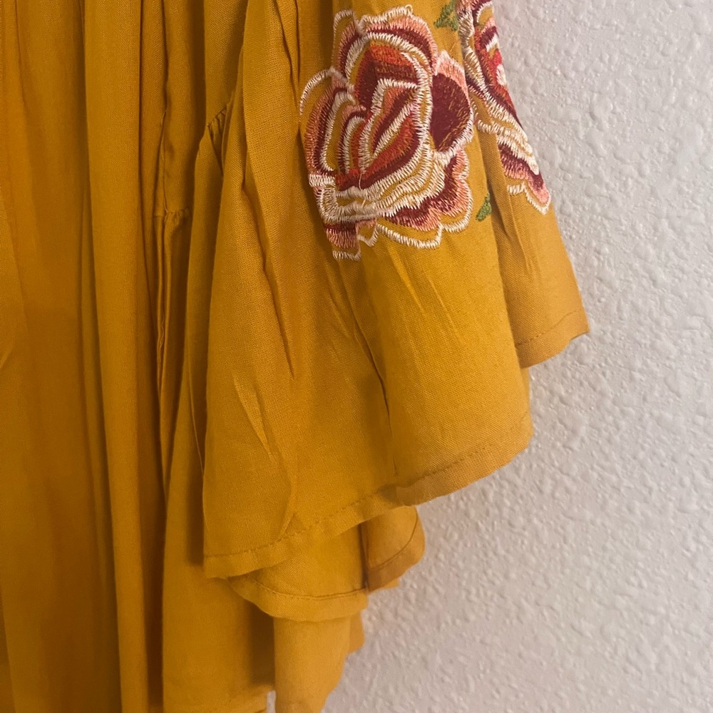 Womans flowy Fall dress in mustard with red rose detailing on the sleeves - Picture 5 of 6